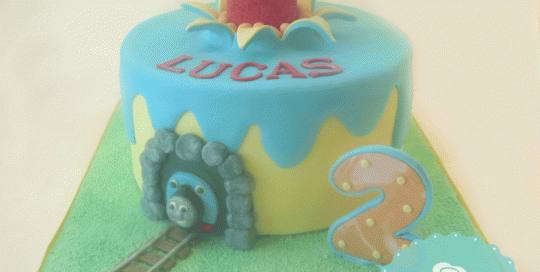 fondant elmo, fondant thomas the train, elmo popping out of cake, train track, vancouver cakes, yellow and blue cake